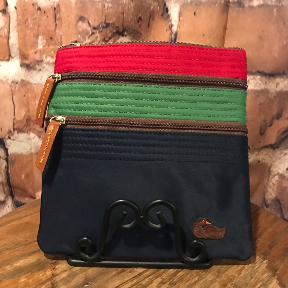 Dooney & Bourke crossbody purse. Nylon. Black, green, red adjustable straps